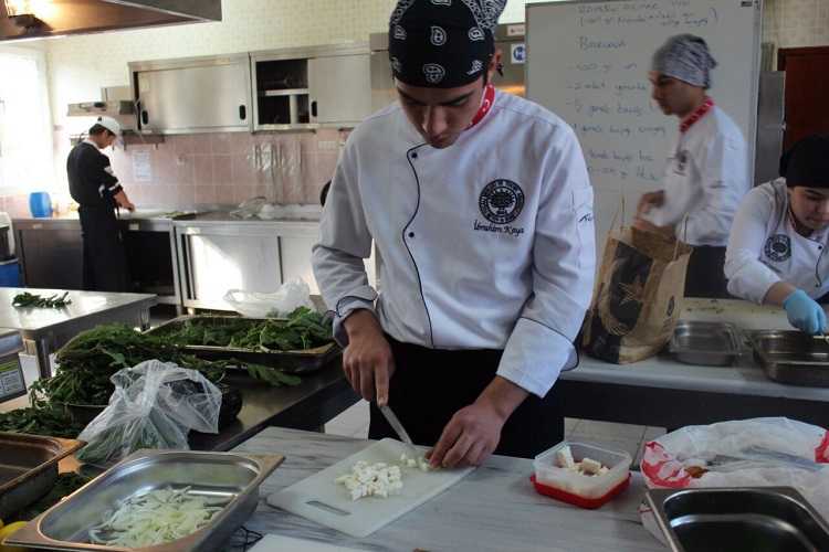 One of the 16 student chefs of the Halim Foçali VTAH learning to cook traditional vegetables (BFN Turkey)